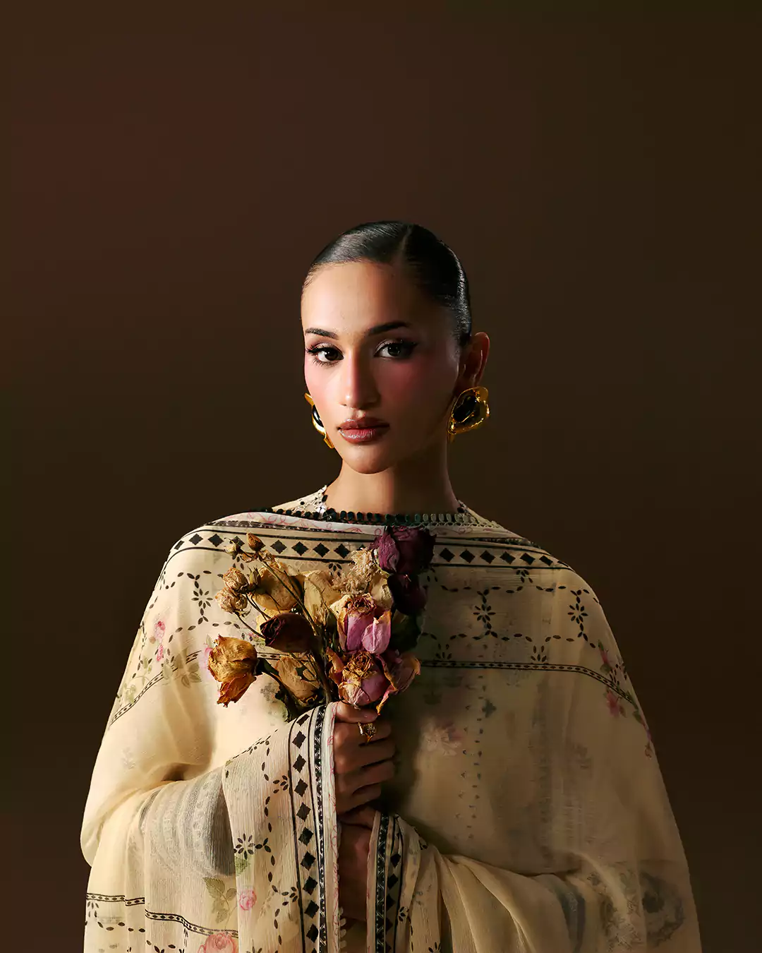 Female model posing in elegant lawn dress during SABLE V photoshoot Lahore