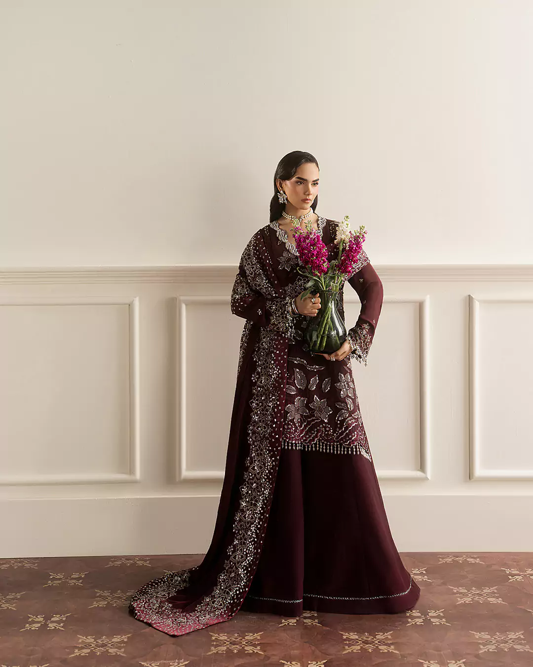 Elegant female model posing in Sirra Formals couture outfit during editorial shoot