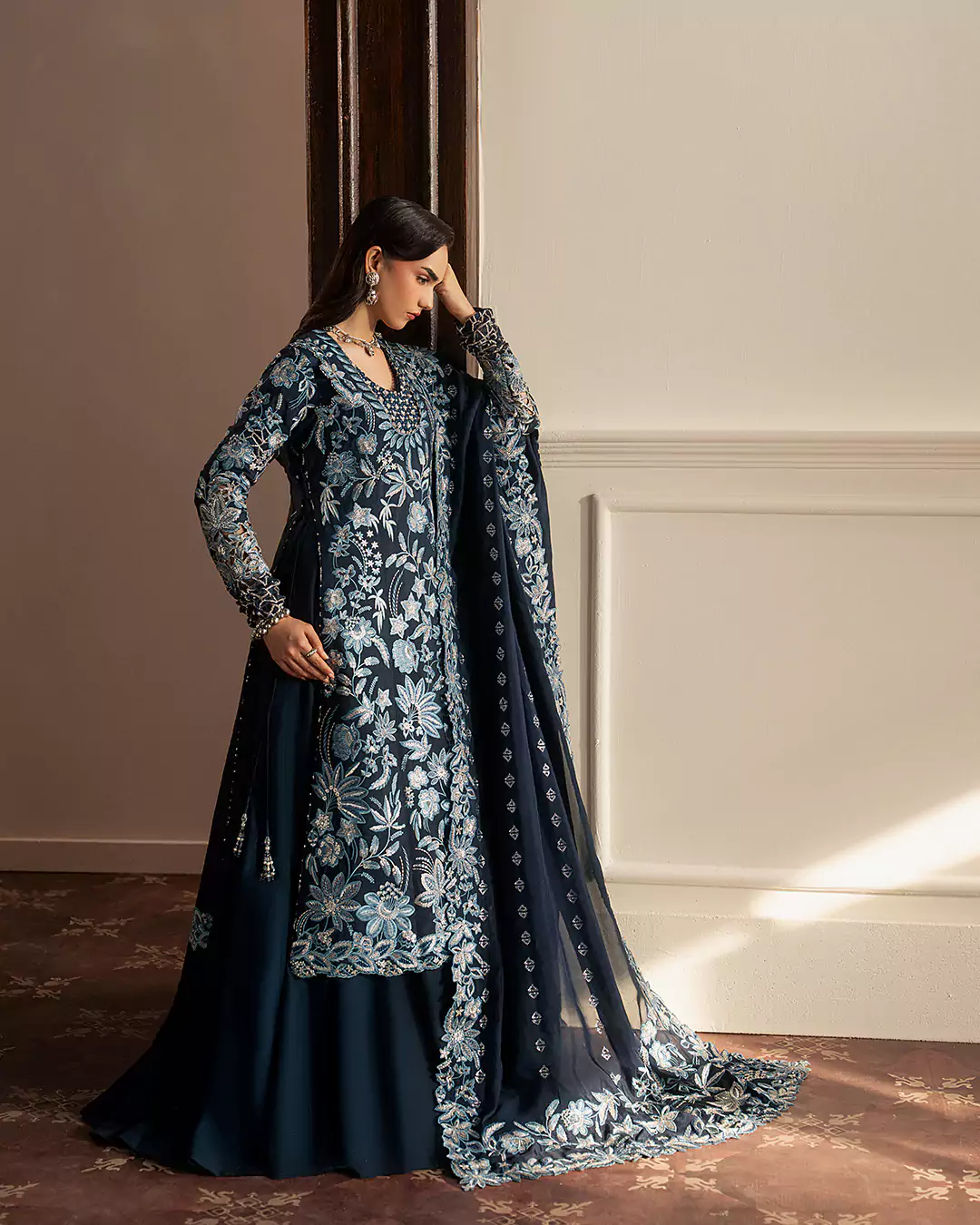 Fashion model posing in outdoor-inspired editorial setup for Sirra Formals campaign