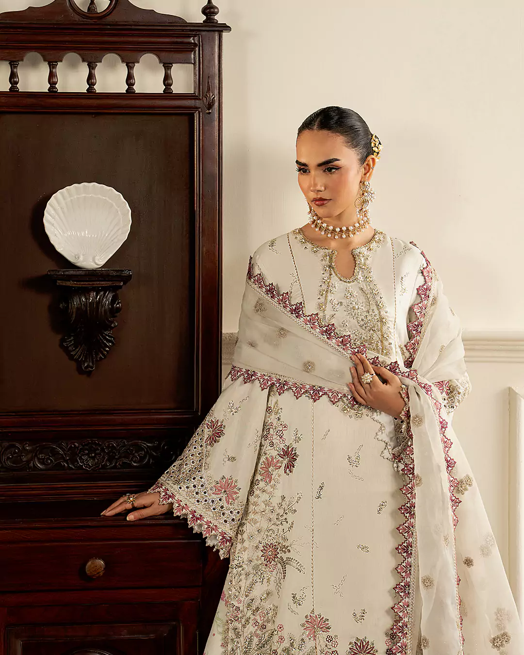 High fashion editorial portrait of model in Sirra Formals 2026 collection
