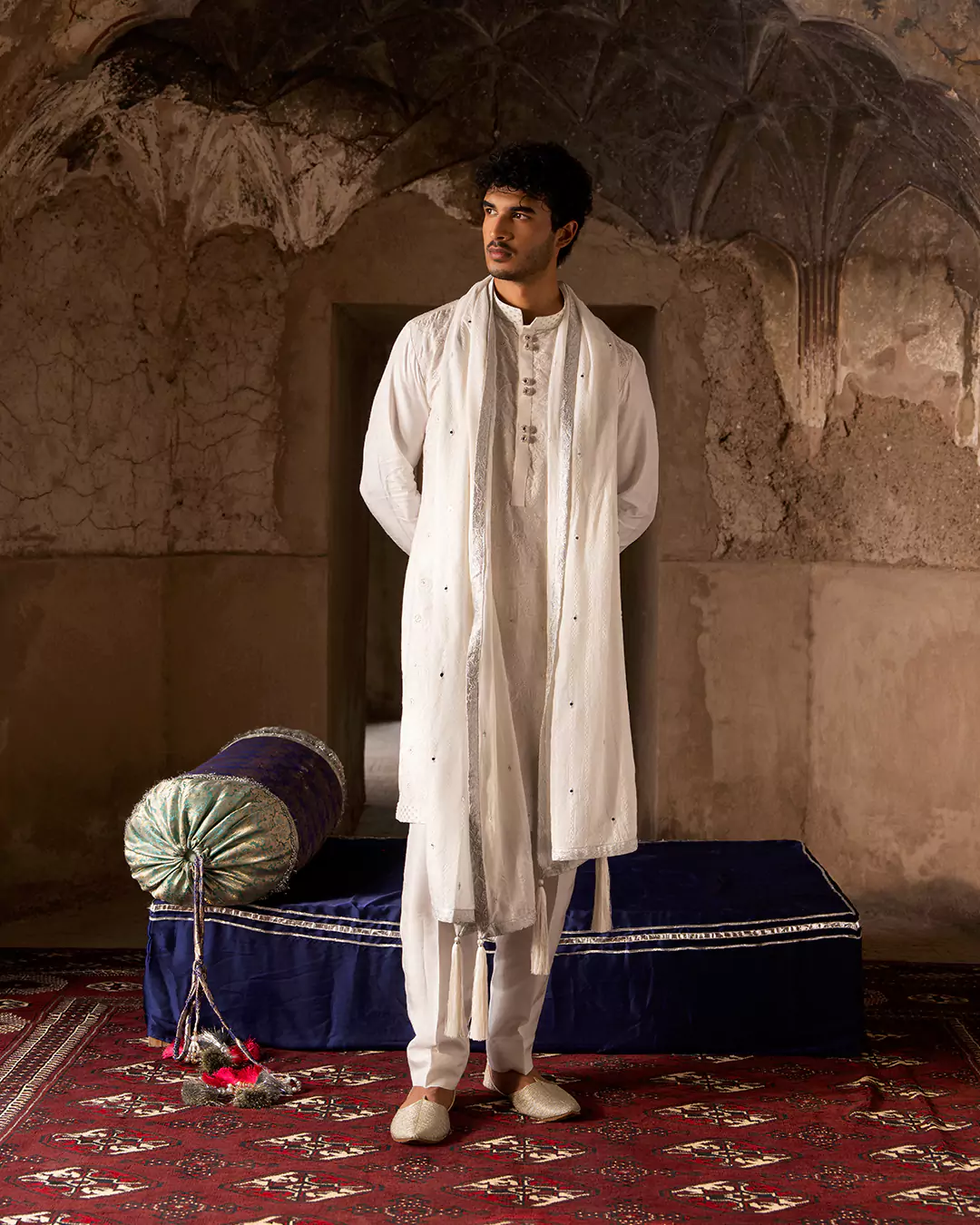 Model in formal festive menswear outfit reflecting luxury eastern fashion aesthetics