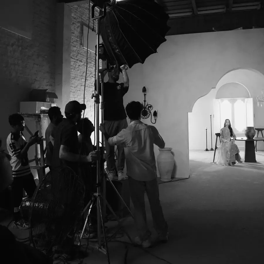 Professional film production crew working on set by Amnah Sikandar Design Studio